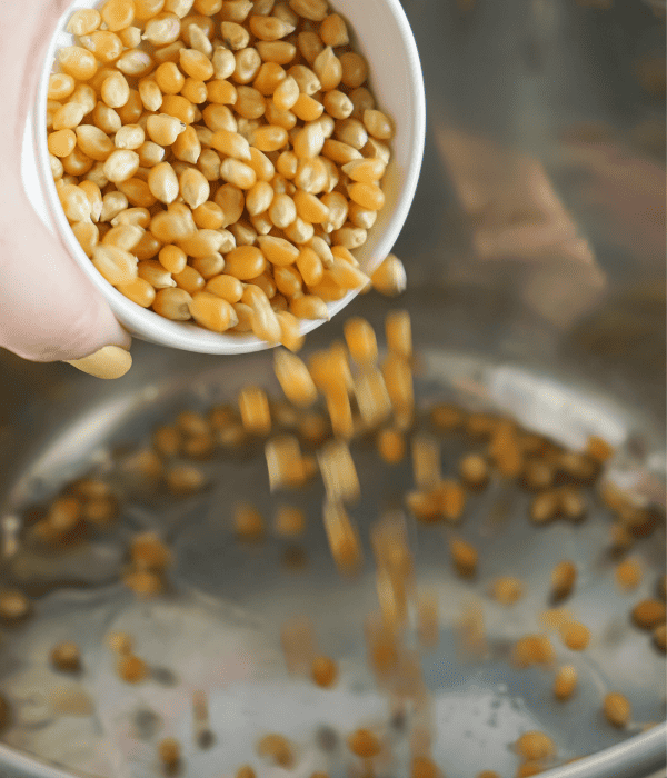 pouring popcorn kernels into instant pot