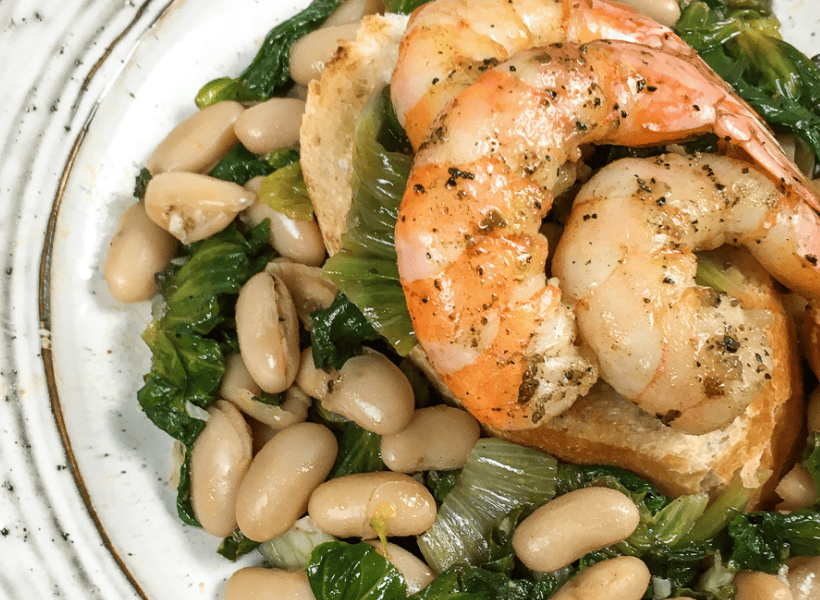 cannellini beans with shrimp on top of crusty toasted italian bread