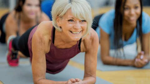 woman over 40 doing core workout plank