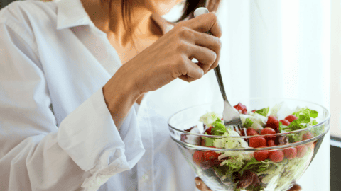 woman eating a salad