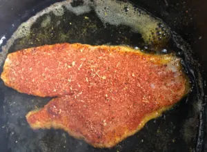 red snapper fried in cast iron skillet