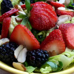 bowl of salad with strawberries and blackberries and homemade Vinaigrette