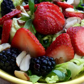 bowl of salad with strawberries and blackberries and homemade Vinaigrette