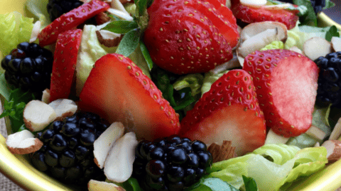 bowl of salad with strawberries and blackberries and homemade Vinaigrette