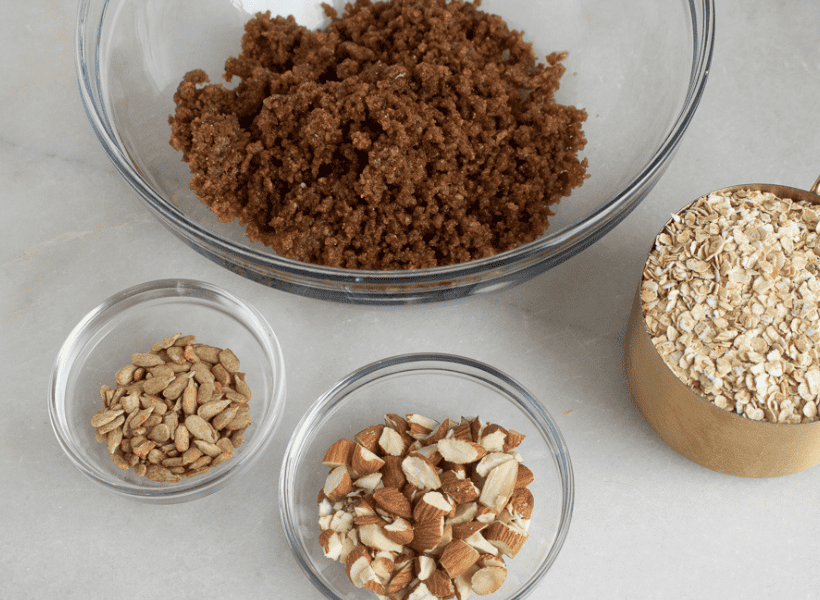 ingredients for granola in small glass bowls