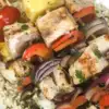 stack of grilled swordfish on plate kabobs