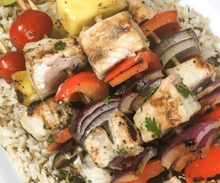 stack of grilled swordfish on plate kabobs