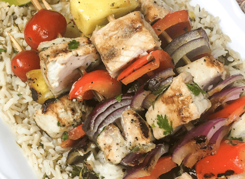 stack of grilled swordfish on plate kabobs