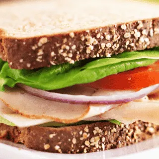 sandwich with lettuce tomato and deli chicken