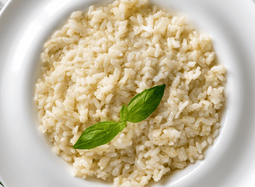 white bowl of risotto with garnish