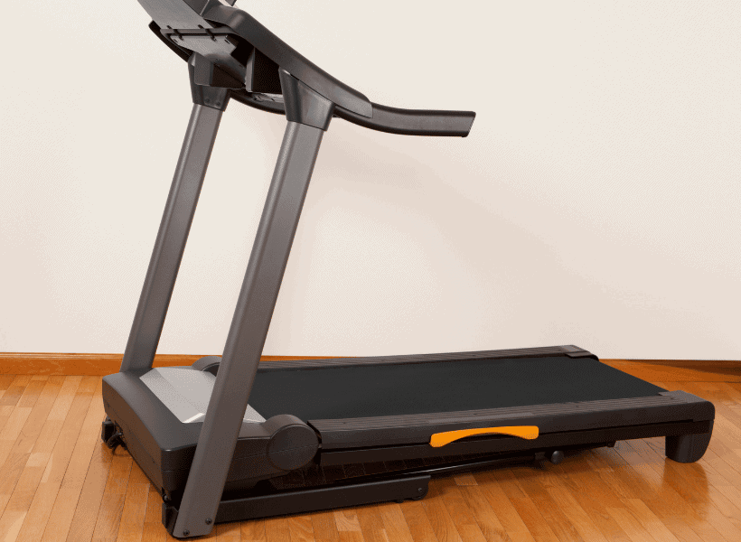 treadmill in empty room with hardwood floors