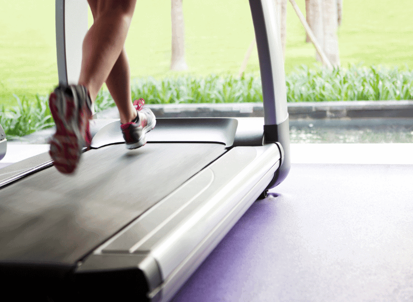 woman's feet running on treadmill