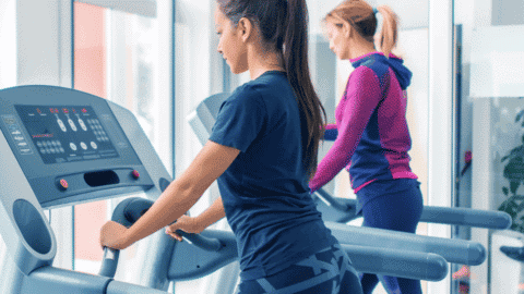 gym with treadmills and ladies walking on treadmills
