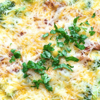 baked egg casserole with bacon and broccoli in pyrex dish