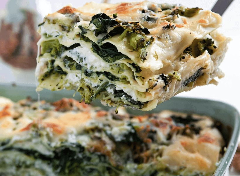 close up of a vegetable lasagna square being served