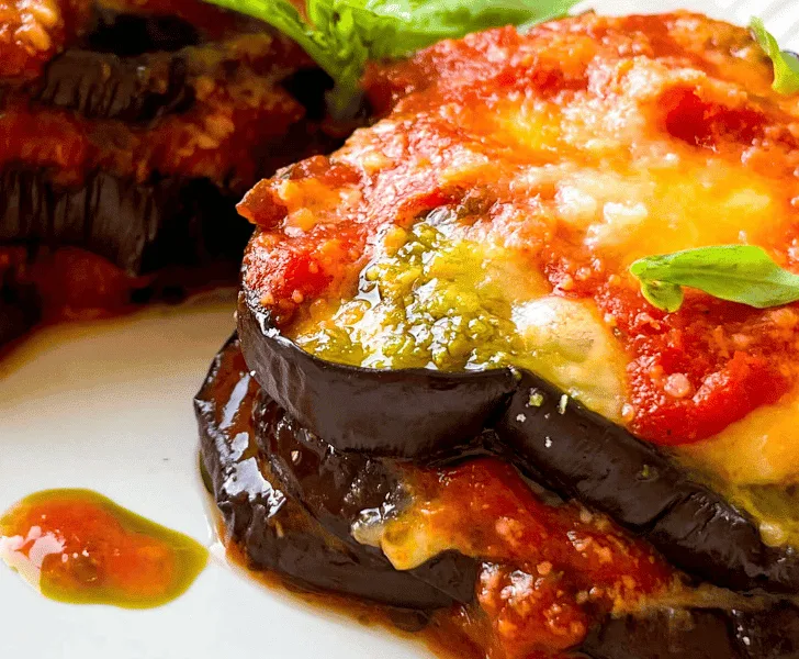 serving of eggplant parmesan without breadcrumbs on a white plate