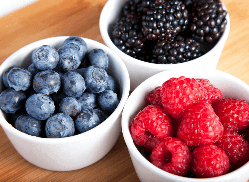 3 bowls with strawberries, blueberries and blackberries