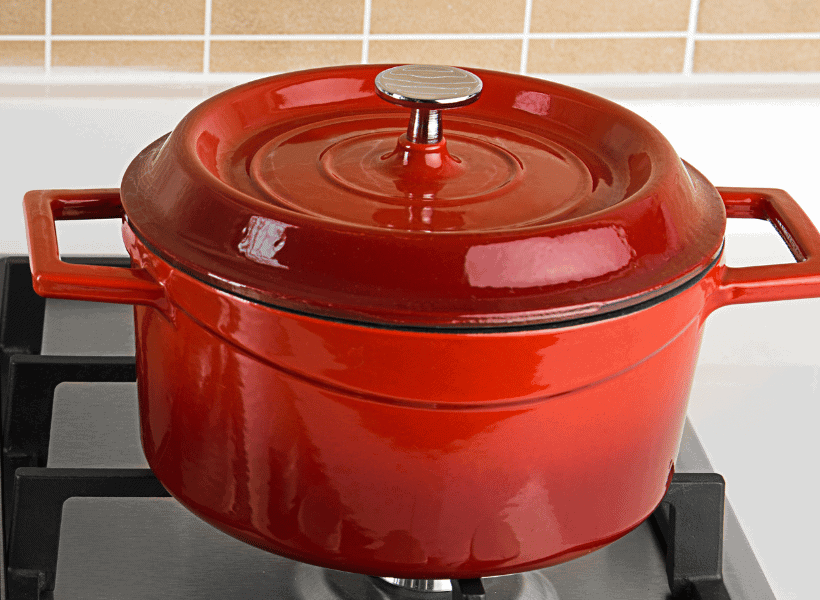 red dutch oven pot on gas stove