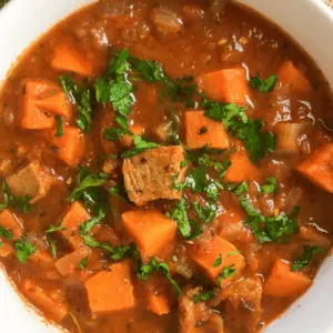 pork stew in a white bowl