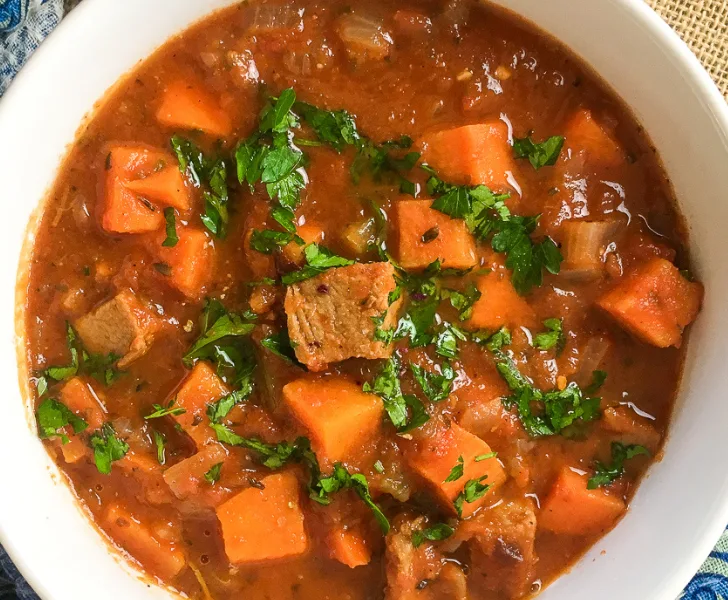 pork stew in a white bowl