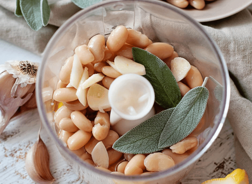 beans, garlic, lemon juice, sage, and olive oil in food processor