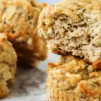 4 banana muffins with one bite taken out of one