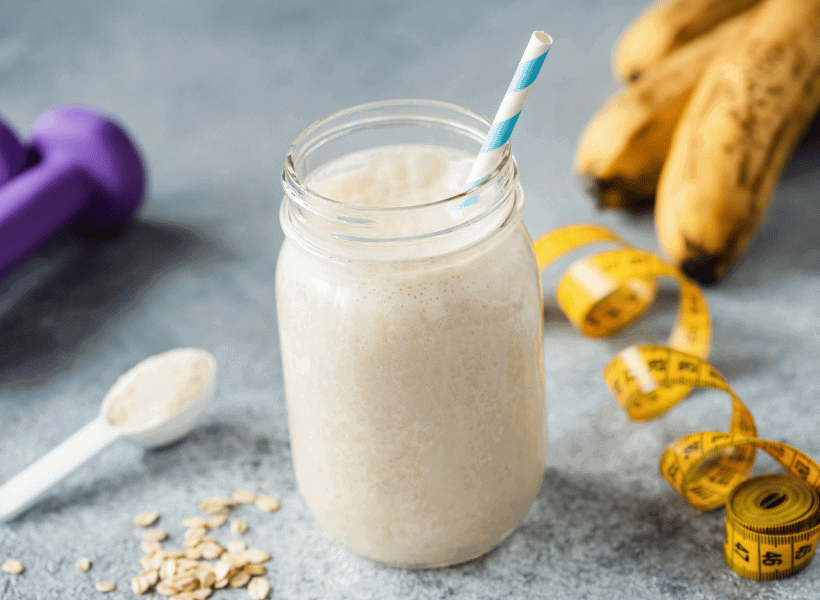 vanilla protein powder mixed in jar with straw