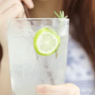 woman drinking sierra mist in glass with straw