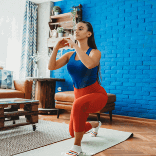 woman working out at home on yoga mat
