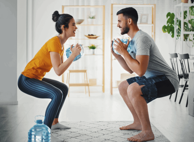 husband and wife working out together at home