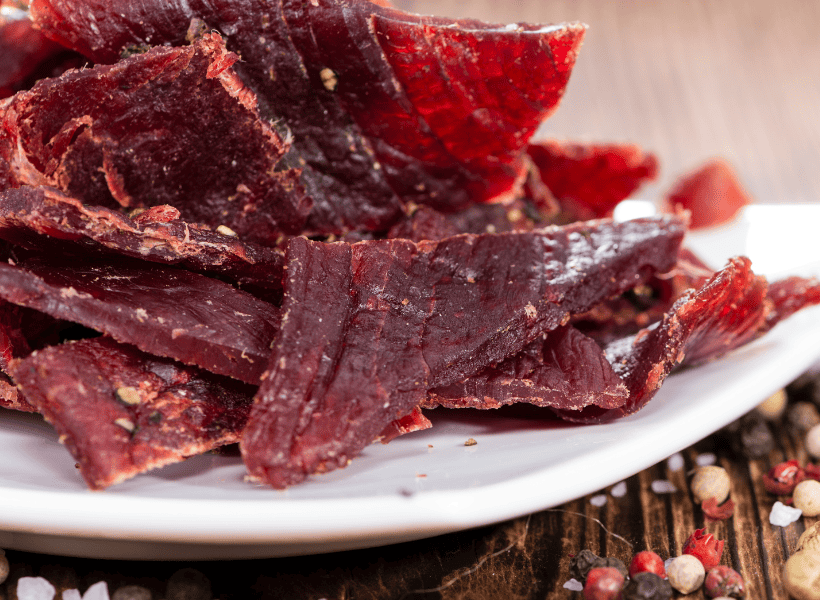 white plate of beef jerky