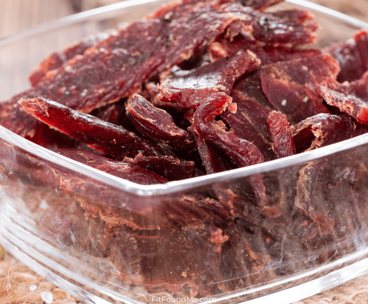 clear glass bowl of beef jerky
