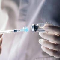Injecting,Injection,Vaccine,Vaccination,Medicine,Against,Covid-19,Into,A,Syringe.