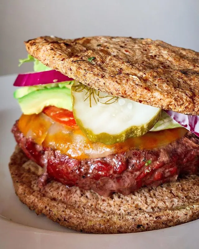 Grilled cheeseburger stacked with lettuce