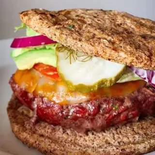 Grilled cheeseburger stacked with lettuce