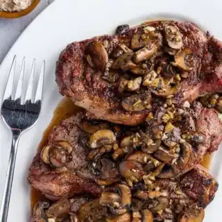 NY Strip with Saut&eacute;ed Garlic Mushrooms