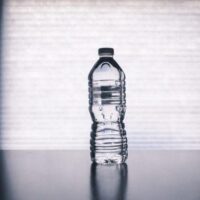 Clear-Disposable-Bottle-on-Black-Surface-800×448