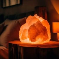 comfortable-bed-glowing-with-candlelight-warmth-generated-by-ai_188544-21594