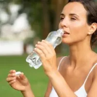 medium-shot-woman-drinking-water_23-2148285832
