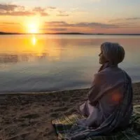 sad-contemplative-person-near-lake_23-2150420677