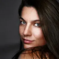 Portrait,Of,Pretty,Woman,Dark,Hair,,Blue,Eyes.,Natural,Smile.