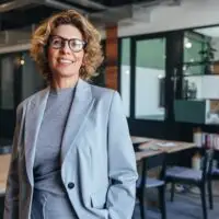 Portrait,Of,A,Professional,Woman,In,A,Suit,Standing,In