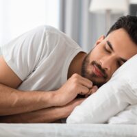Handsome,Man,Sleeping,In,Bed,At,Morning