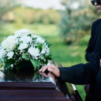 Cropped,Shot,Of,Mature,Woman,And,Her,Family,In,Mourning