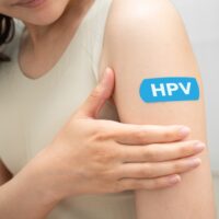The HPV Vaccine Reduces Risk Of Fatal Cervical Cancer Before 30 To Effectively Zero Hpv,,Human,Papillomavirus,,Asian,Young,Woman,Receiving,Vaccine,With,Blue