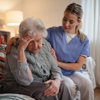 Nurse,Hugging,Elderly,Patient,,Mental,Health,Support,And,Grief,Counseling